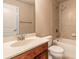 A bright bathroom features a shower-tub combo with neutral tiles, complementing the vanity and white fixtures at 6950 Vintage Ln, Port Orange, FL 32128