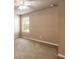 Bright bedroom featuring carpet, neutral paint, ceiling fan, and a large window at 6950 Vintage Ln, Port Orange, FL 32128