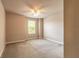 Bedroom with window, neutral paint and carpet, creating a cozy and versatile space at 6950 Vintage Ln, Port Orange, FL 32128