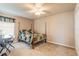 Bedroom features four-poster bed, ceiling fan, and carpet flooring for a comfortable space at 6950 Vintage Ln, Port Orange, FL 32128