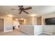 Second floor bonus room featuring carpet, neutral paint, ceiling fan and view of mounted television at 6950 Vintage Ln, Port Orange, FL 32128