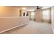Large bonus room with carpet, neutral walls, and ceiling fan provides flexible living space at 6950 Vintage Ln, Port Orange, FL 32128