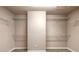 The spacious closet features shelving and neutral paint, ready for organization and storage solutions at 6950 Vintage Ln, Port Orange, FL 32128