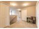 Upstairs hallway with carpet, storage closets, and space for a desk setup at 6950 Vintage Ln, Port Orange, FL 32128