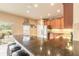 Spacious kitchen featuring stainless appliances, granite countertops, and a bar overlooking the backyard at 6950 Vintage Ln, Port Orange, FL 32128
