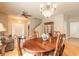 Inviting living space featuring hardwood floors, chandelier, and dining area, perfect for Gathering gatherings at 6950 Vintage Ln, Port Orange, FL 32128