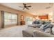 Spacious living area featuring a large sectional sofa, and connection to the kitchen at 6950 Vintage Ln, Port Orange, FL 32128