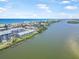 Scenic aerial view of waterfront condos with private boat docks, nestled between the ocean and tranquil bay waters at 845 Ladyfish Ave # B204, New Smyrna Beach, FL 32169
