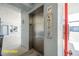 A stainless steel elevator and call button panel is on display at 845 Ladyfish Ave # B204, New Smyrna Beach, FL 32169