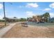 Beach park playground with slides and a shaded picnic area at 845 Ladyfish Ave # B204, New Smyrna Beach, FL 32169