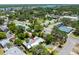 An aerial view of the property showcasing the home, landscaping and neighborhood at 913 Palmetto St, New Smyrna Beach, FL 32168