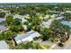 An aerial view of the property showcasing the home, landscaping and neighborhood at 913 Palmetto St, New Smyrna Beach, FL 32168