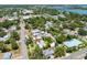 Aerial view of the property showcasing the home, landscaping and neighborhood at 913 Palmetto St, New Smyrna Beach, FL 32168