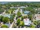 An aerial view of the property showcasing the home, landscaping and neighborhood at 913 Palmetto St, New Smyrna Beach, FL 32168