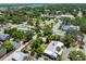 An aerial view of the property showcasing the home, landscaping and neighborhood at 913 Palmetto St, New Smyrna Beach, FL 32168