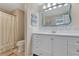 Bathroom featuring white cabinets and a tile backsplash at 913 Palmetto St, New Smyrna Beach, FL 32168