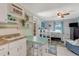 This is an open-concept bedroom with a partial kitchen that includes a small dining area at 913 Palmetto St, New Smyrna Beach, FL 32168