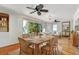 Dining room with a wooden table and wicker chairs at 913 Palmetto St, New Smyrna Beach, FL 32168
