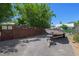 Gravel driveway with privacy fence, leads to a boat on a trailer at 913 Palmetto St, New Smyrna Beach, FL 32168