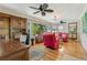 Bright living room featuring hardwood floors and large windows at 913 Palmetto St, New Smyrna Beach, FL 32168