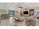 Spacious living area with a vaulted ceiling and lots of natural light at 913 Palmetto St, New Smyrna Beach, FL 32168