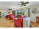 Cozy living room with hardwood floors, natural light, and comfortable seating at 913 Palmetto St, New Smyrna Beach, FL 32168