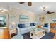 Comfortable living room with tasteful decor and hardwood floors at 913 Palmetto St, New Smyrna Beach, FL 32168