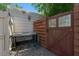 Functional outdoor sink and tiled counter with rustic wooden gate at 913 Palmetto St, New Smyrna Beach, FL 32168