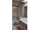 Small bathroom featuring a vanity with a single sink, a standard toilet, and a walk-in shower at 1077 Willow Wood Dr, Port Orange, FL 32129