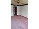 View of a bedroom, showcasing the closet, neutral walls, and ceiling fan at 1077 Willow Wood Dr, Port Orange, FL 32129