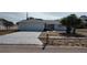 Charming single-story home featuring a white brick facade, well-manicured lawn, and an attached two-car garage at 1077 Willow Wood Dr, Port Orange, FL 32129