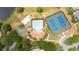 Aerial view showcasing a pool, tennis courts, sand volleyball court, and basketball court at 11222 Rapallo Ln, Windermere, FL 34786