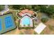 Gorgeous aerial view of the pool and amenities including tennis and basketball courts, and a playground at 11222 Rapallo Ln, Windermere, FL 34786