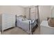 Cozy bedroom with carpeted floors, a window, and light gray walls, and traditional decor at 11222 Rapallo Ln, Windermere, FL 34786