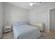 Bedroom featuring a ceiling fan and a dresser, offering ample storage space at 11222 Rapallo Ln, Windermere, FL 34786