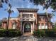 Beautiful clubhouse with terracotta facade, manicured hedges and decorative statues for elegant community gathering at 11222 Rapallo Ln, Windermere, FL 34786