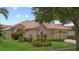 Beautiful one-story home featuring mature landscaping, a barrel tile roof, and neutral stucco siding at 11222 Rapallo Ln, Windermere, FL 34786