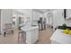 Bright kitchen featuring white cabinets, stainless steel appliances, and quartz countertops at 11222 Rapallo Ln, Windermere, FL 34786