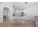 Bright kitchen featuring a breakfast bar with seating and modern appliances at 11222 Rapallo Ln, Windermere, FL 34786