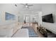 Comfortable living room with a large sofa, area rug, and mounted television at 11222 Rapallo Ln, Windermere, FL 34786