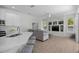 Open concept living area features modern decor, built-in shelving, and luxury vinyl plank flooring at 11222 Rapallo Ln, Windermere, FL 34786