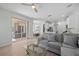 Open-concept living room with neutral tones and sliding glass doors leading to the patio at 11222 Rapallo Ln, Windermere, FL 34786