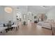 Bright living area with open layout, light hardwood floors and access to patio at 11222 Rapallo Ln, Windermere, FL 34786