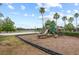 A community playground and sand volleyball court are next to a lake at 11222 Rapallo Ln, Windermere, FL 34786