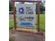 Sign for Dixie Cream Cafe, Tim's Wine & Beer, and Lakeside Real Estate at 11222 Rapallo Ln, Windermere, FL 34786