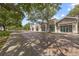 Charming shopping district on a brick road with mature trees, wide sidewalks, and retail storefronts at 11222 Rapallo Ln, Windermere, FL 34786