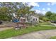 Charming town hall featuring a patriotic horse statue, flags, and lush greenery at 11222 Rapallo Ln, Windermere, FL 34786