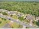This aerial view showcases the home's proximity to green spaces within a serene neighborhood at 115 Los Arbor Dr, Deland, FL 32724