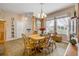 Inviting dining room with wood floors, a chandelier, and bright natural light at 115 Los Arbor Dr, Deland, FL 32724