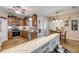 Open concept kitchen with stainless steel appliances, and raised bar counter at 115 Los Arbor Dr, Deland, FL 32724